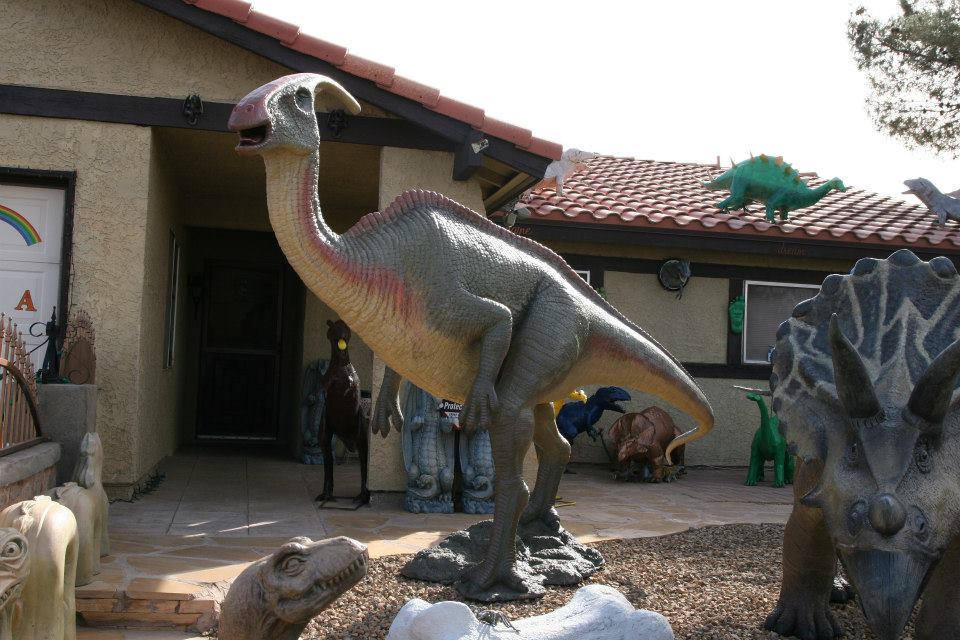 a large brownish
                 two-legged dinosaur standing upright with a long tail, long neck and crest
                 off the back of its head 